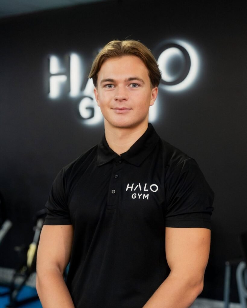 George Shine, personal trainer at Halo Gym in Tunbridge Wells, standing in the gym’s training area ready to coach clients.