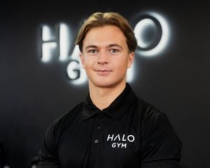 George Shine, personal trainer at Halo Gym in Tunbridge Wells, standing in the gym’s training area ready to coach clients.